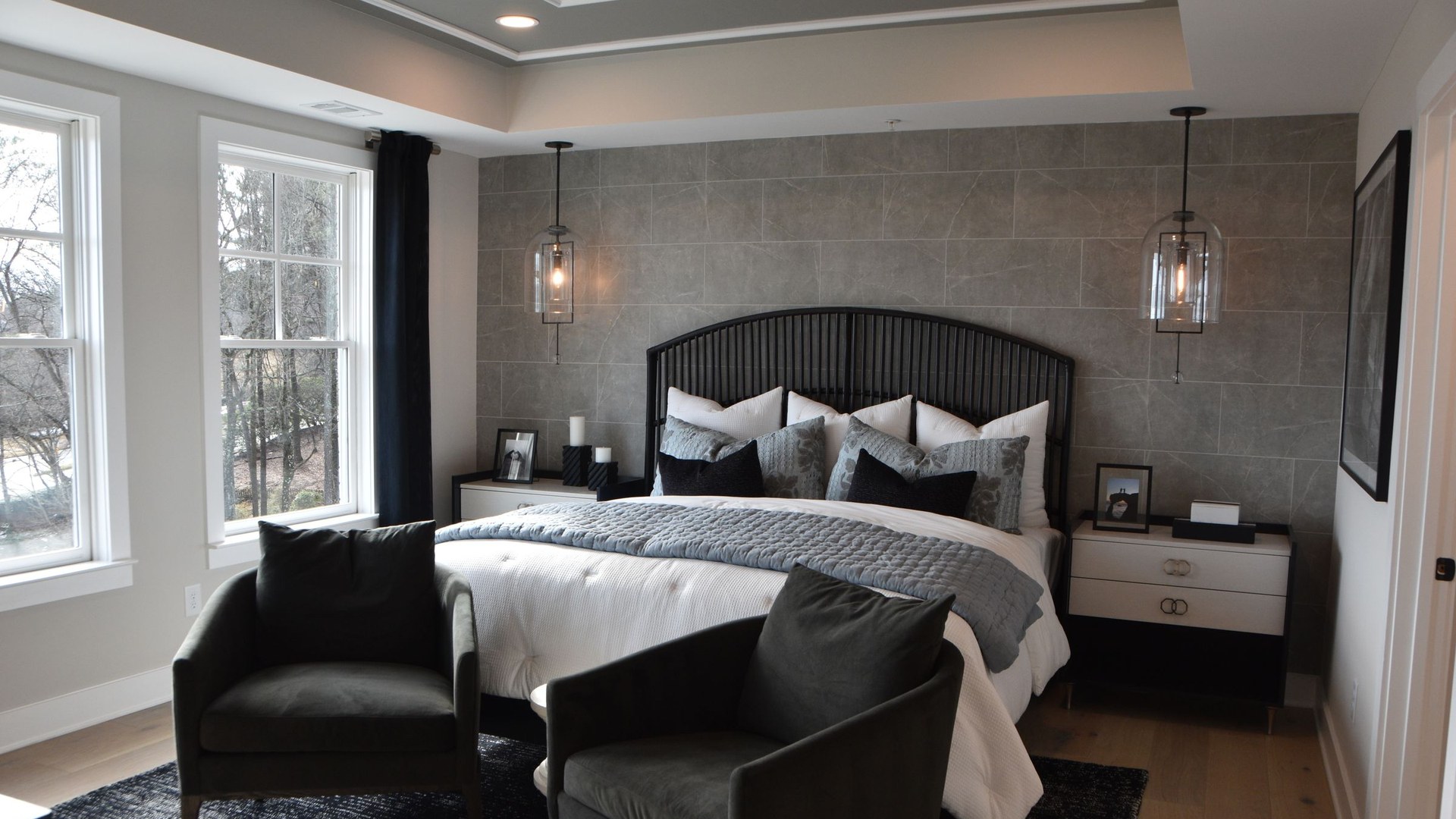 Bridle Path Residence — An upholstered headboard wall taken from floor to ceiling, with the bed built into it rather than placed against it.